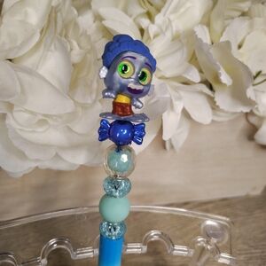 Colorful Character Pen with Blue and Gray Accents